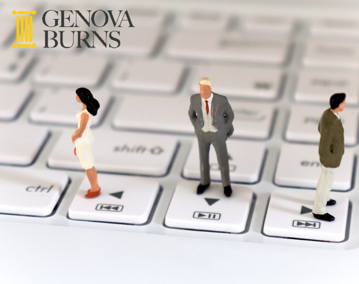  two miniature men and one miniature woman standing on a keyboard in picture